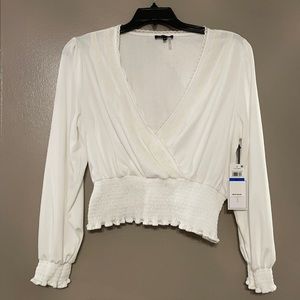 Smocked long sleeve V-neck top